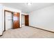 Bright bedroom with double doors to closet and access to hallway at 5385 Camargo Rd, Littleton, CO 80123