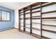 Bedroom with built-in shelving and window with blinds at 5385 Camargo Rd, Littleton, CO 80123