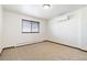 Well-lit bedroom with carpet, window blinds and AC unit at 5385 Camargo Rd, Littleton, CO 80123