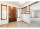 Bright entryway with wood floors and views to living room at 5385 Camargo Rd, Littleton, CO 80123