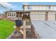 Brick home with two-car attached garage and landscaped yard at 5385 Camargo Rd, Littleton, CO 80123