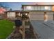 Two-story house with attached garage and landscaping at 5385 Camargo Rd, Littleton, CO 80123