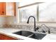 Modern kitchen sink with a double basin and a pull-down faucet at 5385 Camargo Rd, Littleton, CO 80123