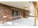 Covered patio with brick columns and ceiling fan at 5385 Camargo Rd, Littleton, CO 80123