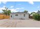 Backyard features a gravel area, patio stones, wooden fence, and access to the house at 742 Hanover St, Aurora, CO 80010