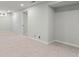 Bright basement space featuring carpet, light walls, and doors with an open design concept at 742 Hanover St, Aurora, CO 80010