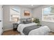 Cozy bedroom with wood floors, neutral walls, and a comfortable bed with plush pillows at 742 Hanover St, Aurora, CO 80010