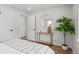 Neutrally decorated bedroom featuring wood floors, modern furniture, and plenty of natural light at 742 Hanover St, Aurora, CO 80010