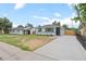 Charming home with gray exterior, well-maintained lawn, and a long driveway at 742 Hanover St, Aurora, CO 80010