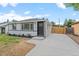 Charming single-story home with a well-maintained lawn and freshly paved driveway at 742 Hanover St, Aurora, CO 80010