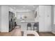 Modern kitchen featuring stainless steel appliances, a breakfast bar, and ample cabinet space for storage at 742 Hanover St, Aurora, CO 80010