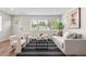 Inviting living room with modern furnishings, lots of natural light and a welcoming atmosphere at 742 Hanover St, Aurora, CO 80010