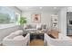Bright living room featuring neutral tones, modern decor, a stylish rug, and ample natural light at 742 Hanover St, Aurora, CO 80010