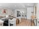 Bright living space with modern decor, light hardwood floors, and open floor plan with bar seating at 742 Hanover St, Aurora, CO 80010