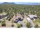 Beautiful aerial view of the home on a large lot, surrounded by lush greenery and mature trees at 7947 Monarch Rd, Larkspur, CO 80118