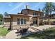 Expansive backyard with outdoor dining area, landscaped yard, and built-in grill at 7947 Monarch Rd, Larkspur, CO 80118