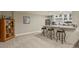 Entertaining area with granite counter top, bar stools and display shelving at 7947 Monarch Rd, Larkspur, CO 80118