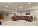 Expansive basement living area features neutral carpeting, recessed lighting and comfortable seating at 7947 Monarch Rd, Larkspur, CO 80118