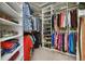 Spacious walk-in closet with custom shelving and ample storage space for shoes and clothes at 7947 Monarch Rd, Larkspur, CO 80118