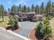 Attractive home with a three-car garage and well-manicured lawn and landscaping at 7947 Monarch Rd, Larkspur, CO 80118