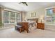 Serene main bedroom with large windows, a ceiling fan, and neutral decor at 7947 Monarch Rd, Larkspur, CO 80118