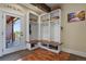 Mudroom with built-in storage, wood accents, and easy access to the outdoors at 7947 Monarch Rd, Larkspur, CO 80118