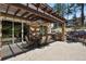 Beautiful outdoor patio area featuring a dining table, grill, and plenty of space for entertaining at 7947 Monarch Rd, Larkspur, CO 80118