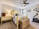Comfortable bedroom featuring neutral walls, soft carpet, and a ceiling fan for air circulation promoting a relaxing atmosphere at 17404 E Prentice Cir, Centennial, CO 80015