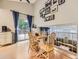 Charming dining area with an open layout, leading to an outdoor deck and an upper-level view at 17404 E Prentice Cir, Centennial, CO 80015