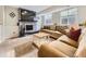 Cozy living room with a fireplace, large TV, and comfortable seating perfect for relaxation and entertainment at 17404 E Prentice Cir, Centennial, CO 80015