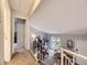 A staircase leads to a comfortable living room featuring neutral-toned walls, carpet, and natural light creating a calming ambiance at 17404 E Prentice Cir, Centennial, CO 80015