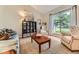 Bright living room with large window, comfortable seating, and stylish decor at 17404 E Prentice Cir, Centennial, CO 80015