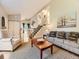 Inviting living room showcases an open floor plan and a staircase leading to the upper level at 17404 E Prentice Cir, Centennial, CO 80015