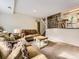 Cozy living room with neutral walls, plush carpet, comfortable seating, and natural light, creating a relaxing ambiance at 17404 E Prentice Cir, Centennial, CO 80015