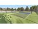 Outdoor pickleball court surrounded by a fence with net, well-maintained, and lush green surrounding at 17404 E Prentice Cir, Centennial, CO 80015