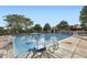 Inviting swimming pool with clear blue water, poolside seating, and mature shade trees at 17404 E Prentice Cir, Centennial, CO 80015