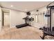 Spacious workout room with treadmill, weight machine, and wall mirror at 17404 E Prentice Cir, Centennial, CO 80015