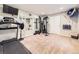 Spacious workout room with treadmill, weight machine, and wall mirror at 17404 E Prentice Cir, Centennial, CO 80015