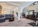 Versatile basement area with comfortable seating, a coffee table, gym equipment, and a beverage center at 8438 Prairie Clover Way, Parker, CO 80134