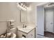 Well-lit bathroom with towel rack, toiletries, and a mirrored medicine cabinet for added storage at 8438 Prairie Clover Way, Parker, CO 80134