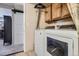 Convenient laundry room features updated appliances and storage cabinets in neutral tones at 8438 Prairie Clover Way, Parker, CO 80134