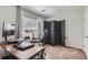 Bright office space with a large desk, comfortable chair, and privacy screen for focused work at 8438 Prairie Clover Way, Parker, CO 80134