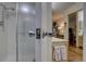 Bright bathroom showcasing the shower and an open doorway to the main bedroom at 13631 E Marina Dr # 109, Aurora, CO 80014