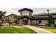 Attractive community clubhouse with stone accents, green lawn, and benches at 13631 E Marina Dr # 109, Aurora, CO 80014