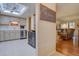 Bright kitchen featuring stainless steel appliances, white cabinetry, and ample counter space, enhanced by a skylight at 13631 E Marina Dr # 109, Aurora, CO 80014