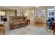 Living room filled with furniture and light, thanks to lots of windows at 13631 E Marina Dr # 109, Aurora, CO 80014