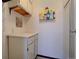 Functional mud room with storage cabinets and shelves, enhanced by colorful artwork and practical design at 13631 E Marina Dr # 109, Aurora, CO 80014