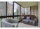 Relaxing sunroom featuring large windows, comfortable seating and exterior views at 13631 E Marina Dr # 109, Aurora, CO 80014