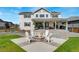 A beautiful backyard offers a fire pit, outdoor dining and seating spaces at 10968 Lewiston St, Commerce City, CO 80022