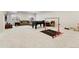 This basement includes a couch, a foosball table, and workout equipment at 10968 Lewiston St, Commerce City, CO 80022